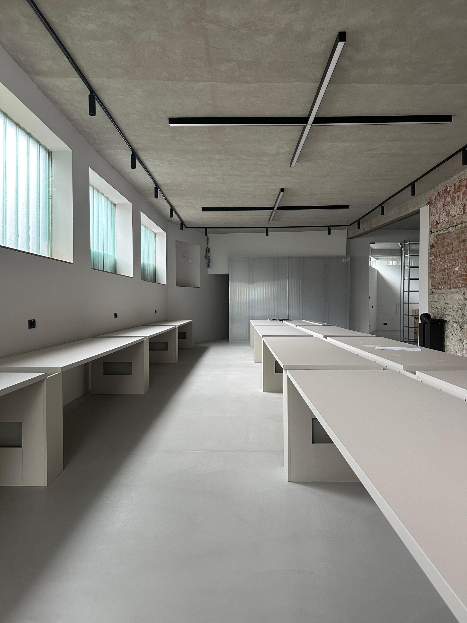 A workspace with many desks.